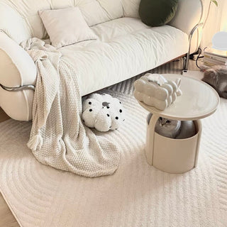 Round storage side table with handlein  includes magazine rack.