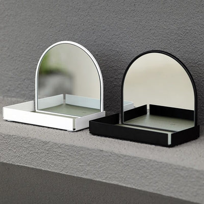 Arched storage tray with mirrorin  for storing small items.