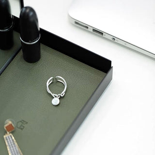 Arched storage tray with mirrorin  for storing small items.
