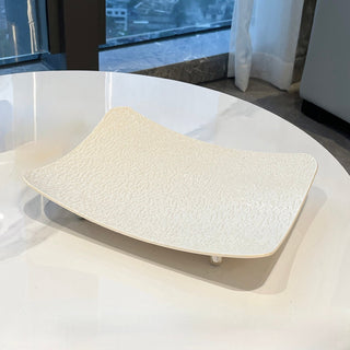 Wavy pattern large tray with legsin  for storage.