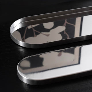 Stainless steel silver oval-shaped simple accessory trayin 3 sizes for storage.
