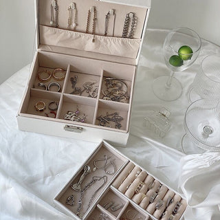 Two-tiered lockable simple jewelry boxin  storage.