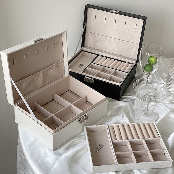 Two-tiered lockable simple jewelry boxin  storage.