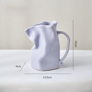 Ceramic flower vase with handlein .