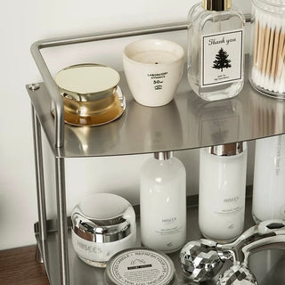 Stainless steel silver storage two-tier display rack for cosmetics and perfumes.