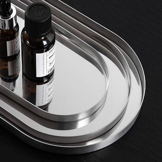 Stainless steel silver oval-shaped simple accessory trayin 3 sizes for storage.