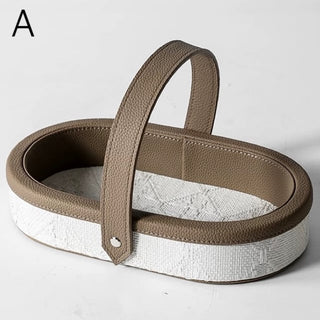 Oval-shaped leather jacquard tray with handlein .