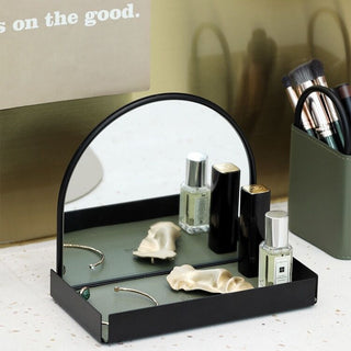 Arched storage tray with mirrorin  for storing small items.