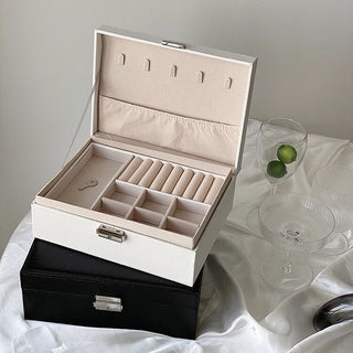 Two-tiered lockable simple jewelry boxin  storage.