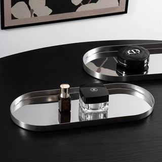 Stainless steel silver oval-shaped simple accessory trayin 3 sizes for storage.