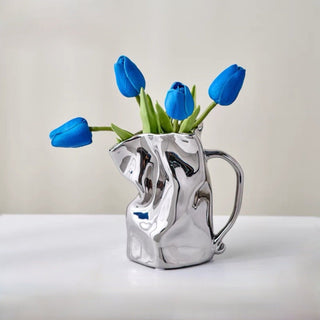 Ceramic flower vase with handlein .