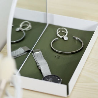 Arched storage tray with mirrorin  for storing small items.