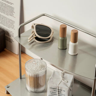 Stainless steel silver storage two-tier display rack for cosmetics and perfumes.