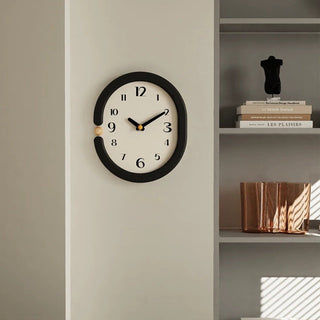 Oval-shaped monochrome modern art wall clock