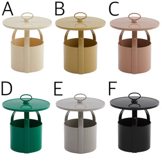 Round storage side table with handlein  includes magazine rack.