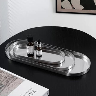 Stainless steel silver oval-shaped simple accessory trayin 3 sizes for storage.