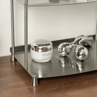 Stainless steel silver storage two-tier display rack for cosmetics and perfumes.