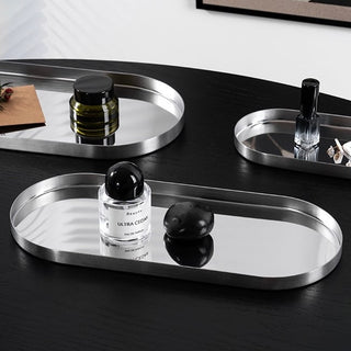 Stainless steel silver oval-shaped simple accessory trayin 3 sizes for storage.