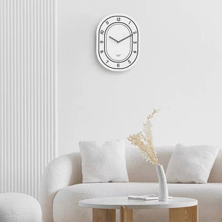 Oval-shaped acrylic white wall clock
