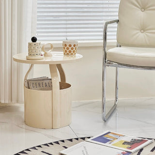 Round storage side table with handlein  includes magazine rack.