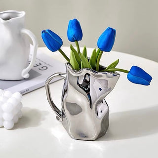 Ceramic flower vase with handlein .