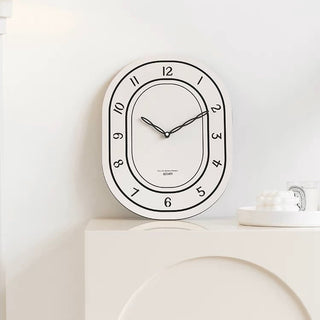 Oval-shaped acrylic white wall clock