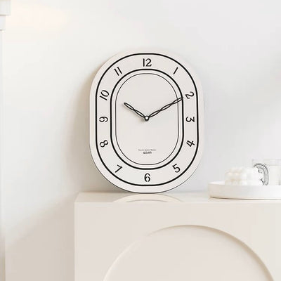 Oval-shaped acrylic white wall clock
