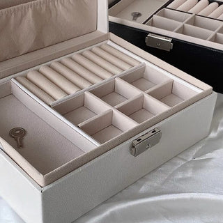 Two-tiered lockable simple jewelry boxin  storage.