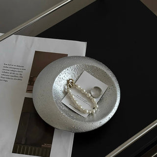 Disc-shaped ceramic accessory trayin  small item tray