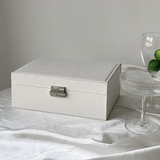 Two-tiered lockable simple jewelry boxin  storage.