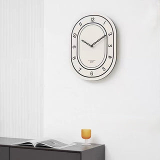 Oval-shaped acrylic white wall clock
