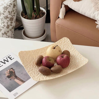 Wavy pattern large tray with legsin  for storage.