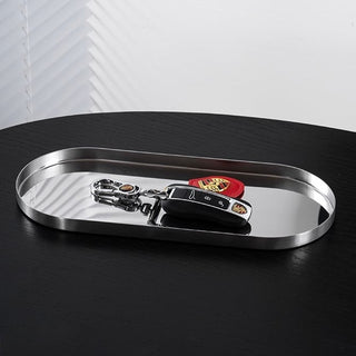 Stainless steel silver oval-shaped simple accessory trayin 3 sizes for storage.
