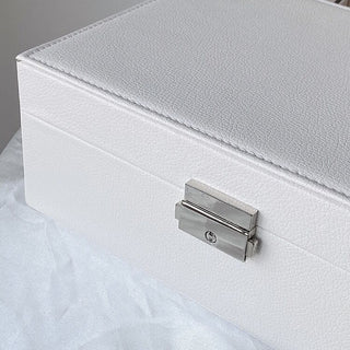 Two-tiered lockable simple jewelry boxin  storage.