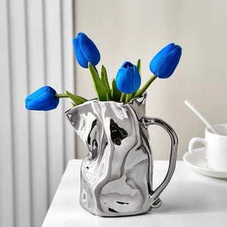 Ceramic flower vase with handlein .