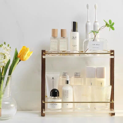 Wood frame clear two-tier rackin  for cosmetic storage.