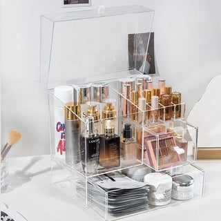Square-shaped clear cosmetic boxin  for makeup storage.