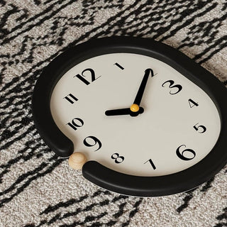 Oval-shaped monochrome modern art wall clock