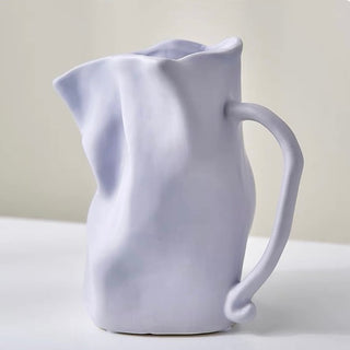 Ceramic flower vase with handlein .