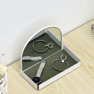 Arched storage tray with mirrorin  for storing small items.
