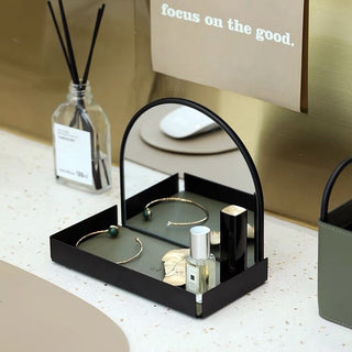 Arched storage tray with mirrorin  for storing small items.