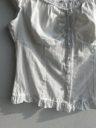 Off-shoulder frill sleeveless blouse