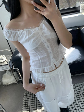 Off-shoulder frill sleeveless blouse