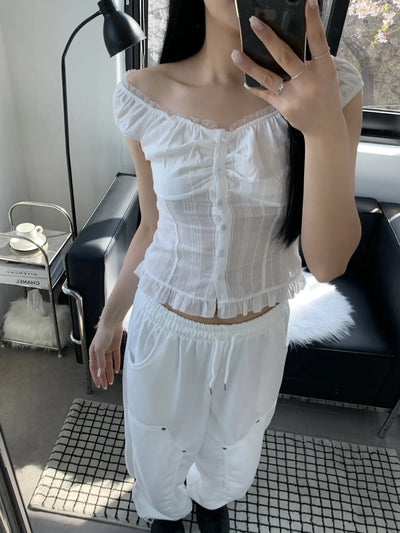 Off-shoulder frill sleeveless blouse