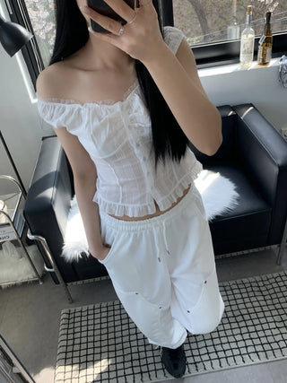 Off-shoulder frill sleeveless blouse