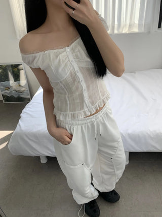 Off-shoulder frill sleeveless blouse