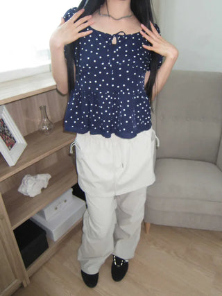 Navy dotted frill puff blouse