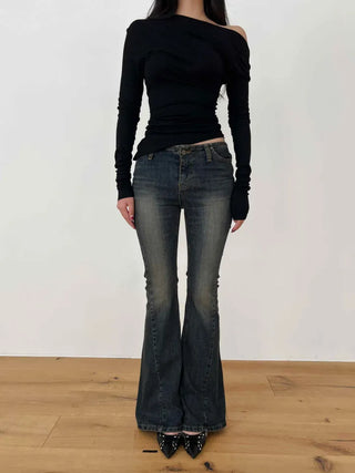Curved low-rise slim bootcut denim pants