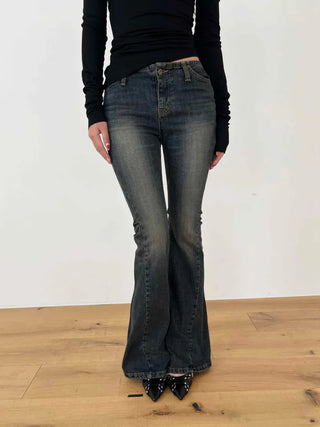 Curved low-rise slim bootcut denim pants