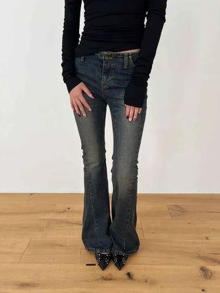 Curved low-rise slim bootcut denim pants